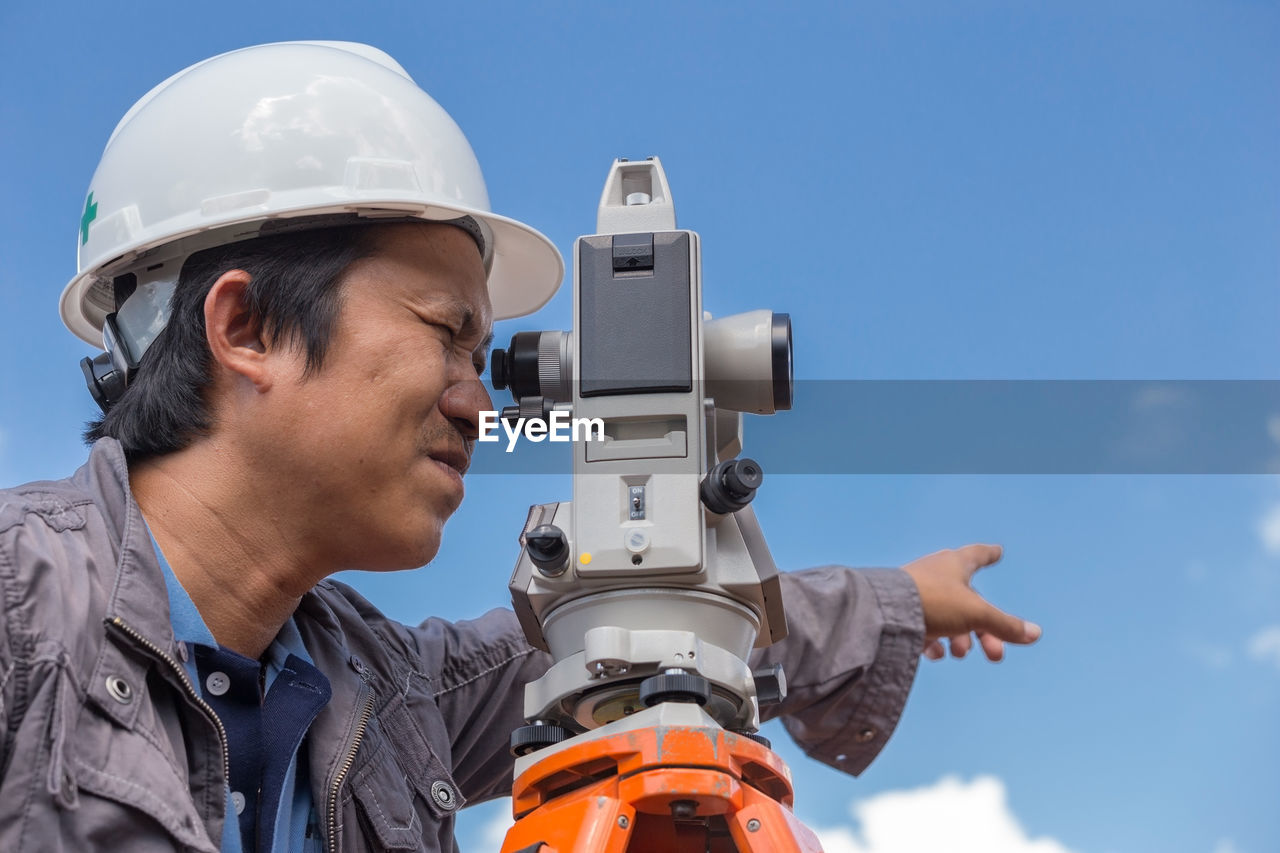 Close-up of surveyor working outdoors