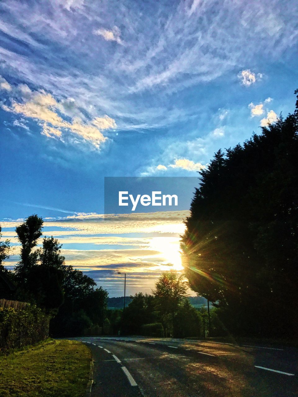 ROAD AGAINST SKY DURING SUNSET