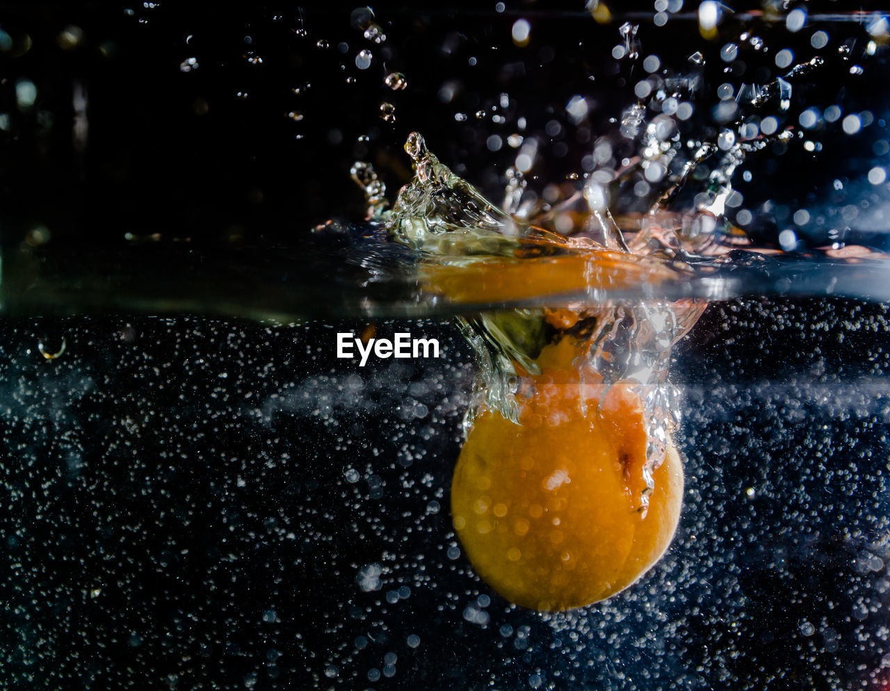 Fruit splashing in water