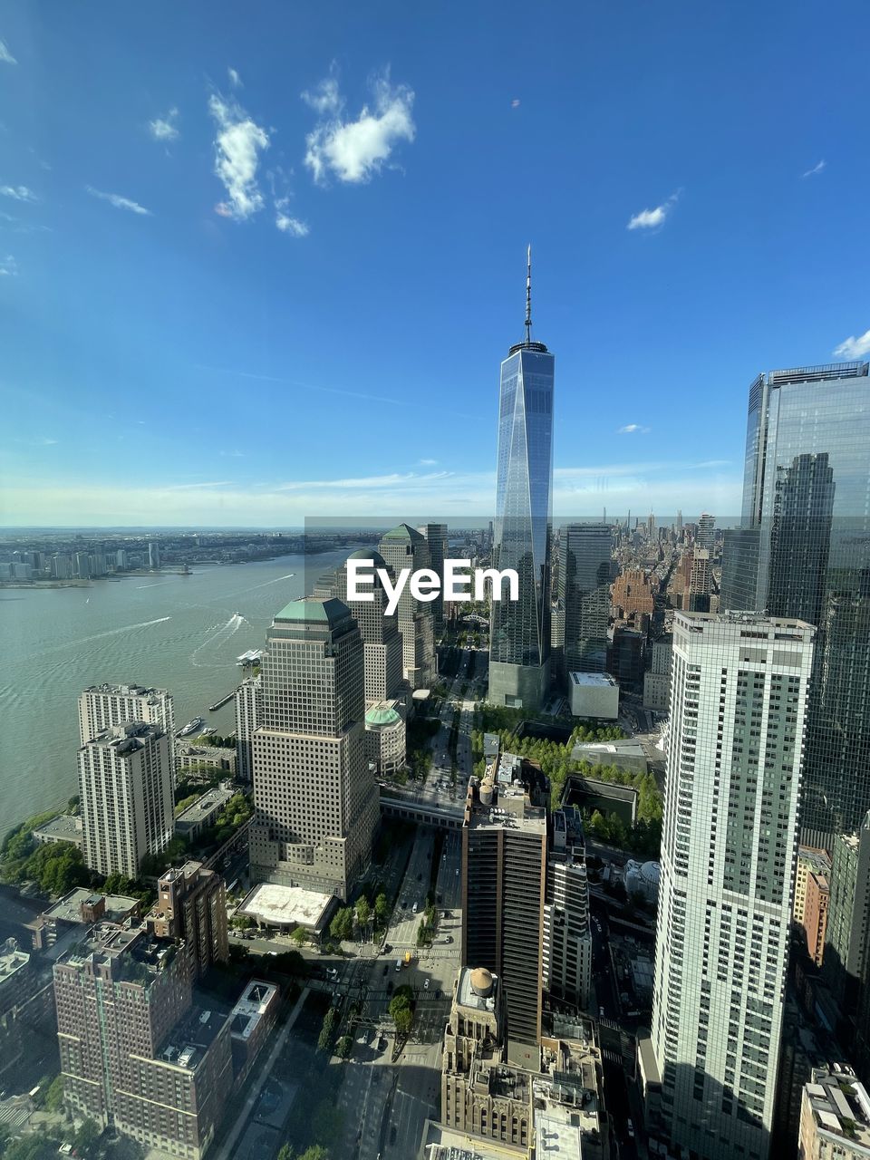 architecture, built structure, building exterior, skyscraper, city, aerial photography, sky, nature, screenshot, water, cityscape, aerial view, building, no people, day, blue, outdoors, reflection, office building exterior, space station, transportation, vehicle, high angle view, cloud, metropolis
