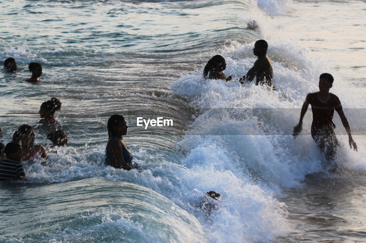 PEOPLE ENJOYING IN SEA