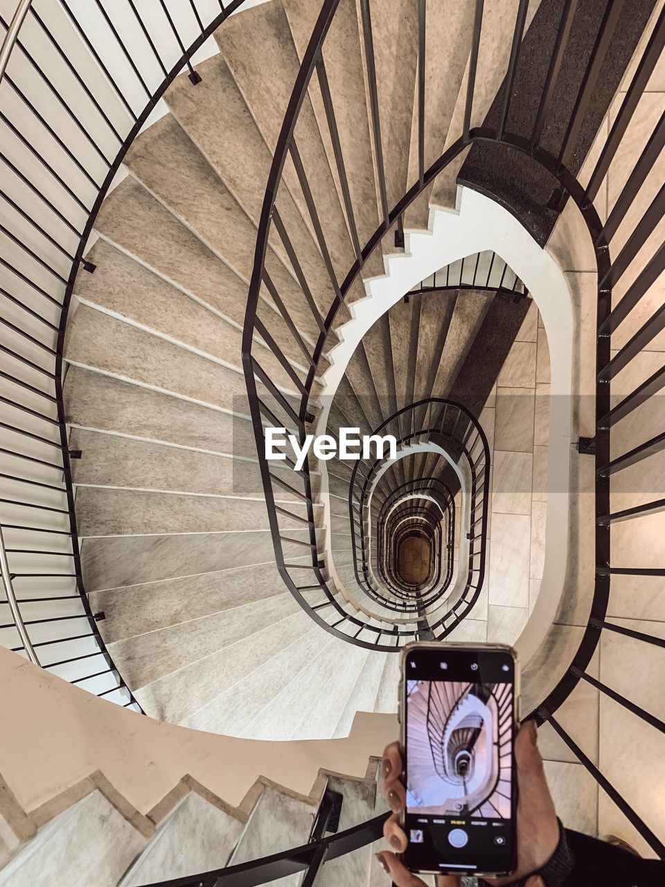 DIRECTLY ABOVE SHOT OF SPIRAL STAIRCASE OF BUILDING