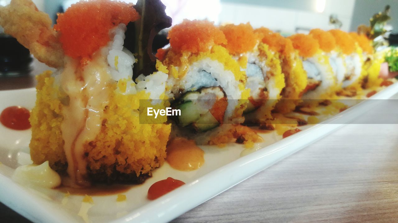 CLOSE-UP OF SUSHI SERVED ON PLATE