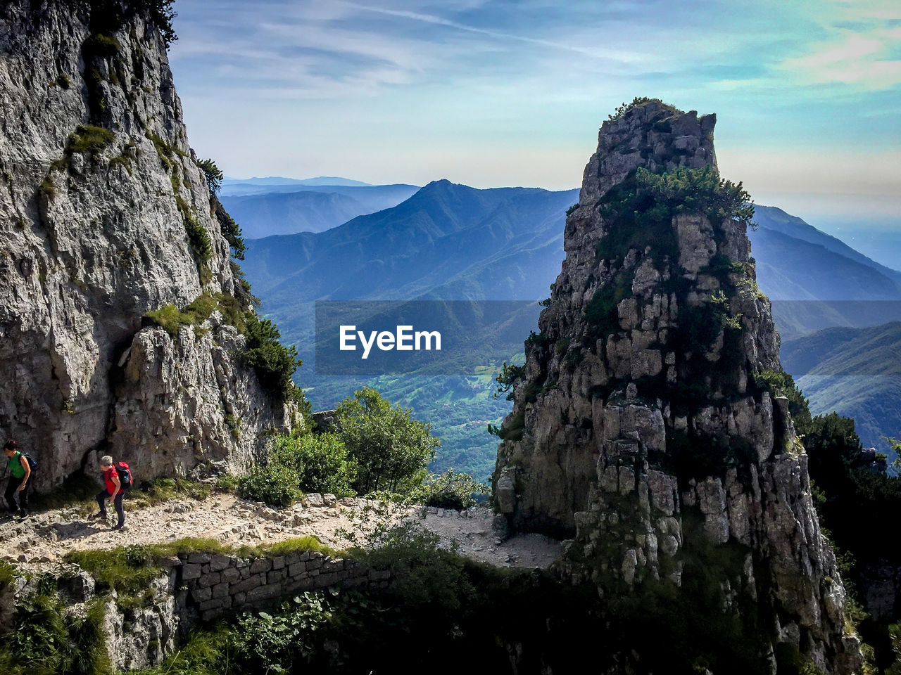 PANORAMIC VIEW OF ROCKS AND MOUNTAINS AGAINST SKY