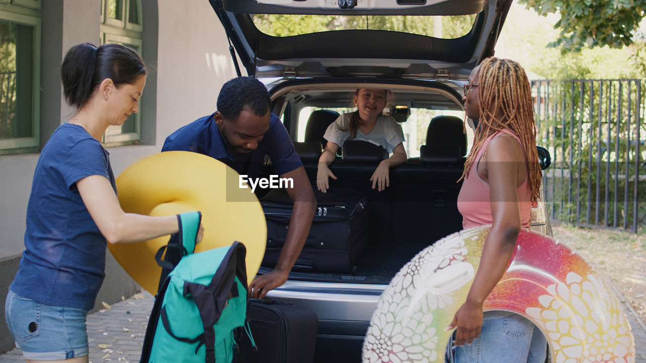 rear view of people sitting in car