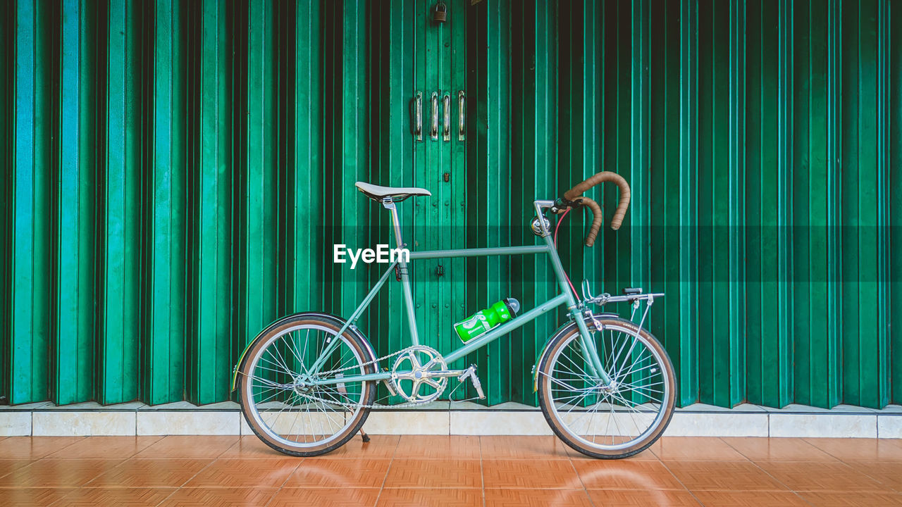 Close-up of green bicycle