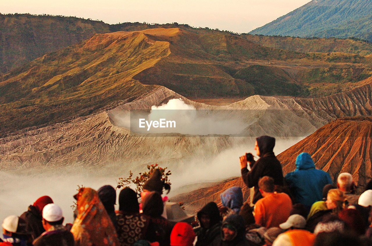 Tourists enjoy the sunrise of mount bromo in east java, indonesia