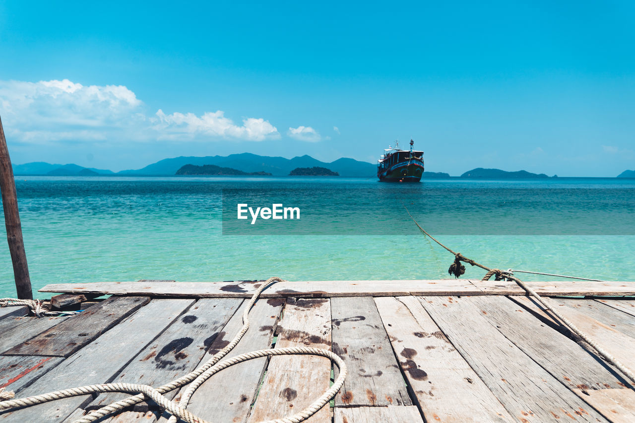 View of pier in sea against sky