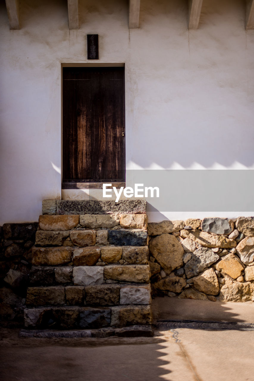 STONE WALL OF BUILDING WITH STAIRCASE