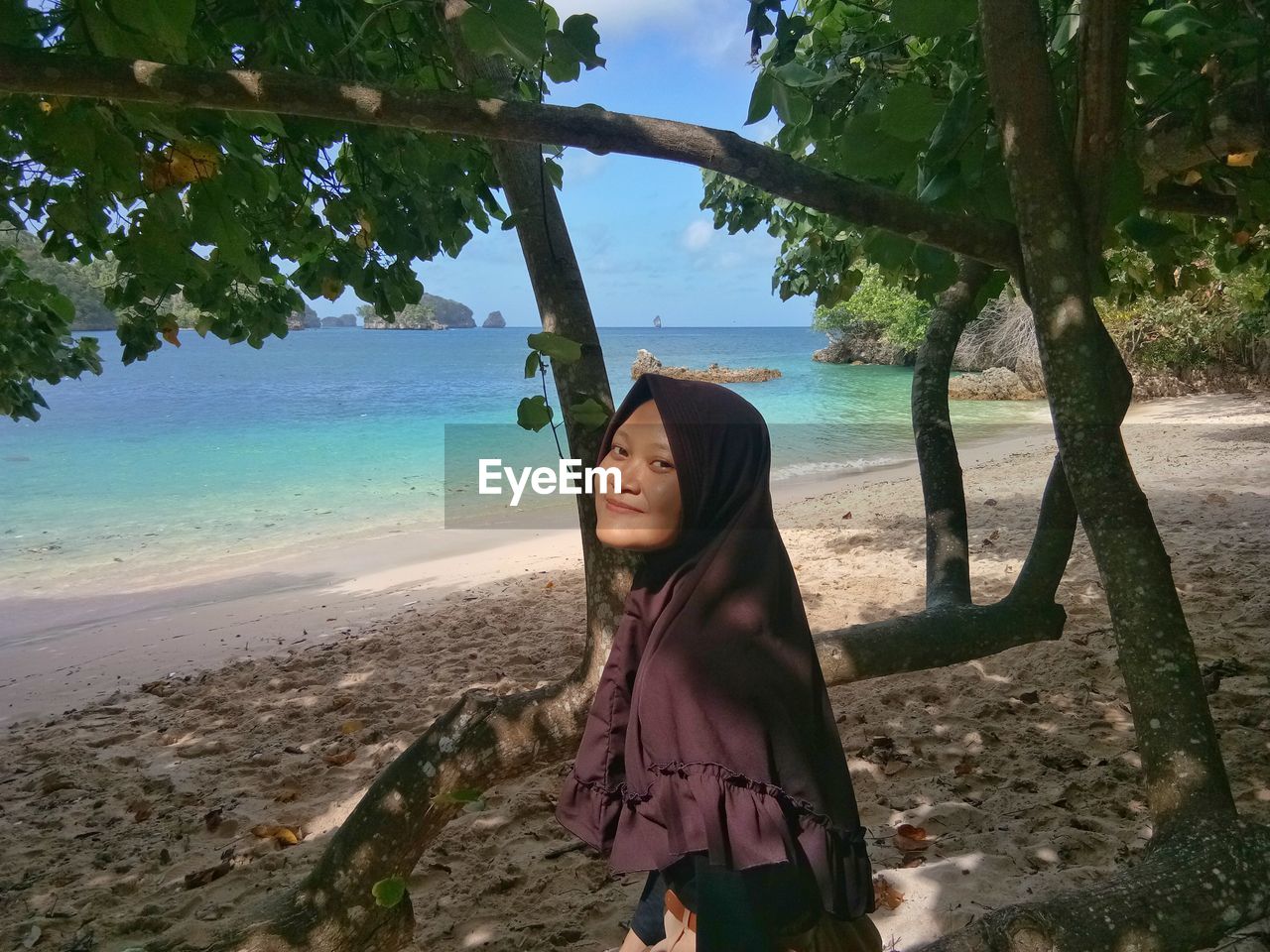 Side view of woman standing on beach