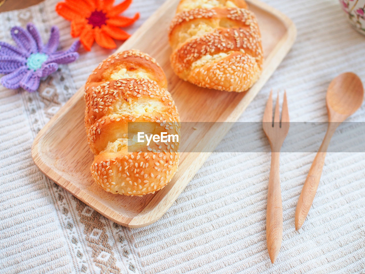 CLOSE-UP OF BREAD ON WOODEN TABLE