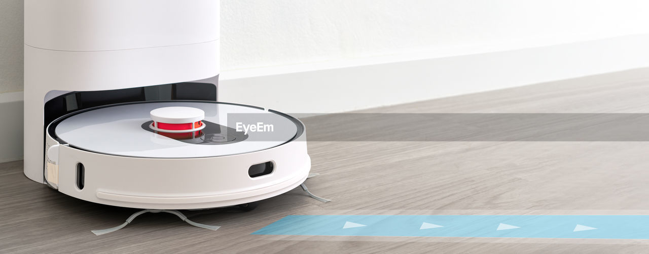 Robotic vacuum cleaner on wood floor smart cleaning technology