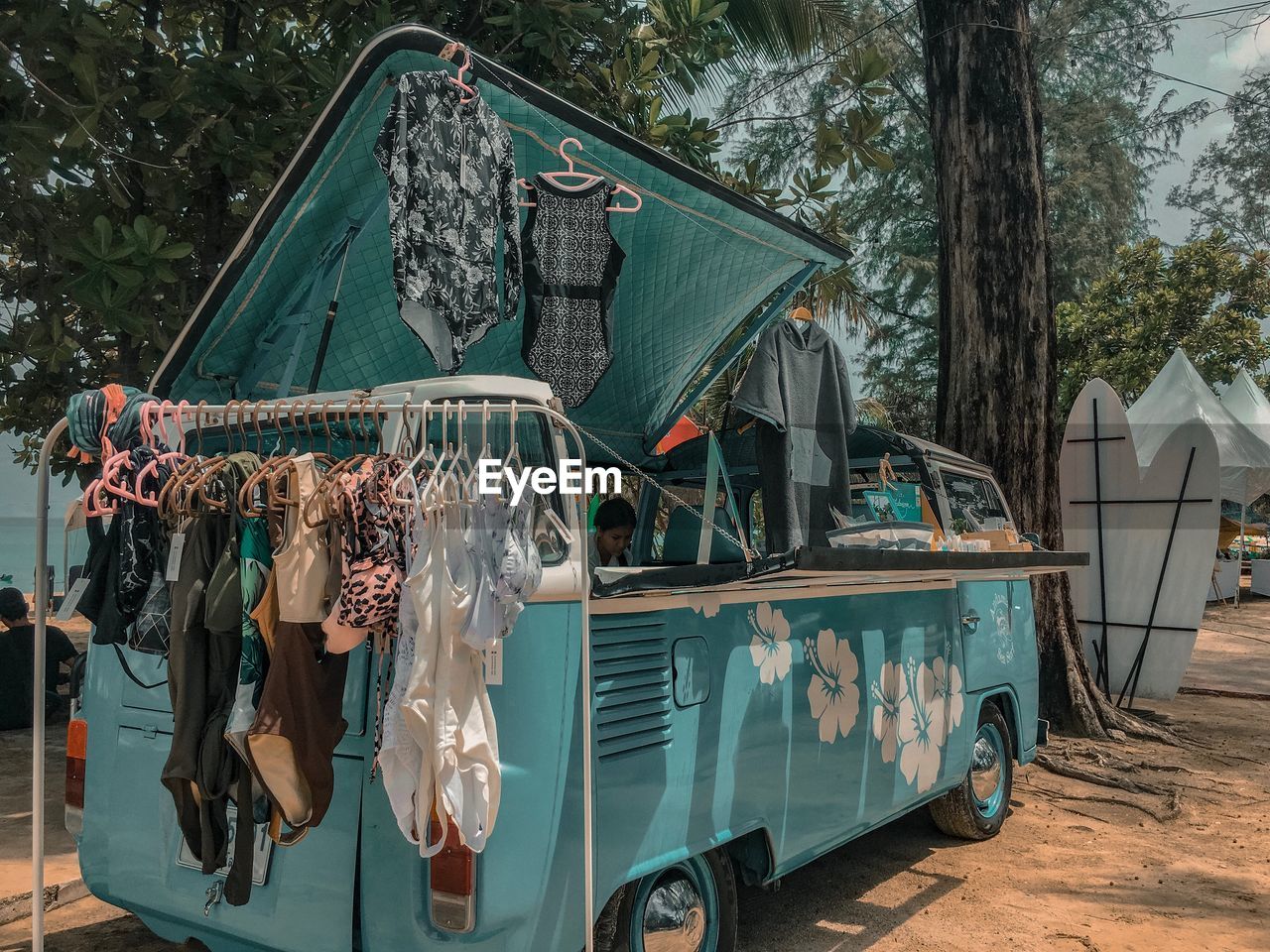 CLOTHES HANGING FROM CAR