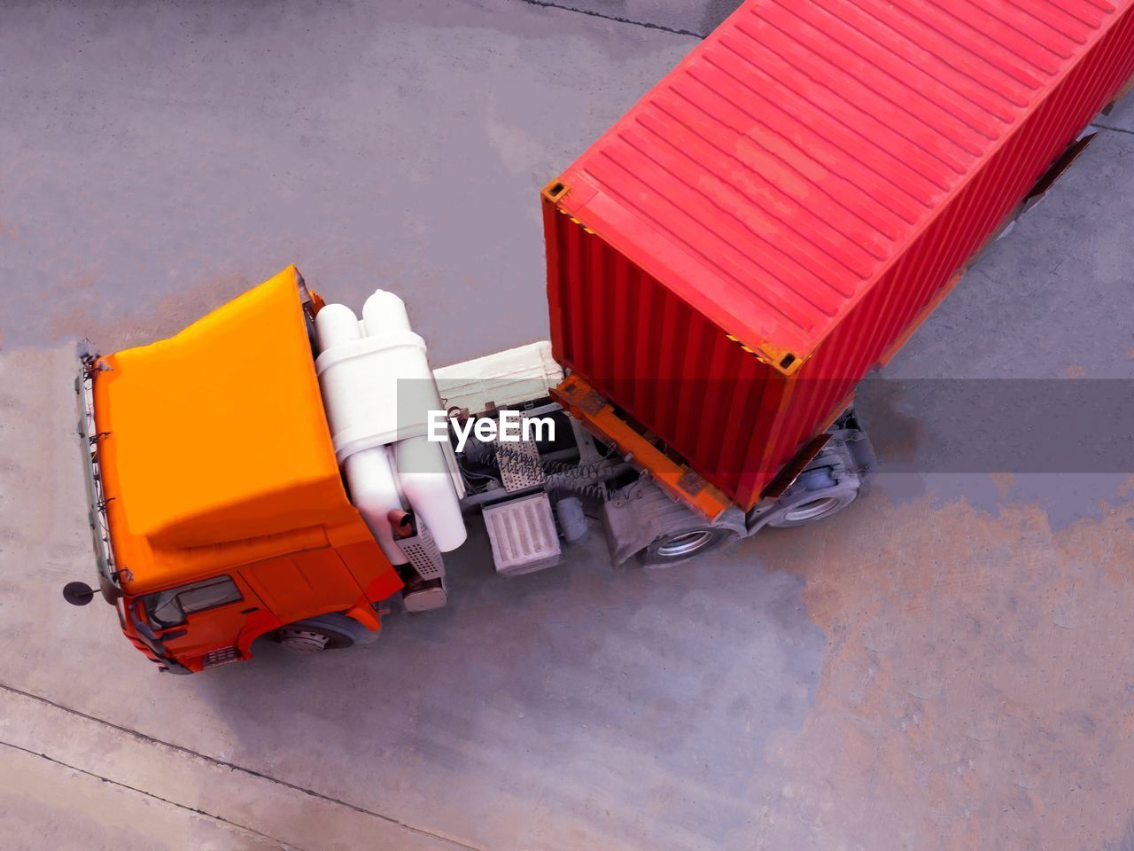 High angle view of red container on semi-truck at harbor