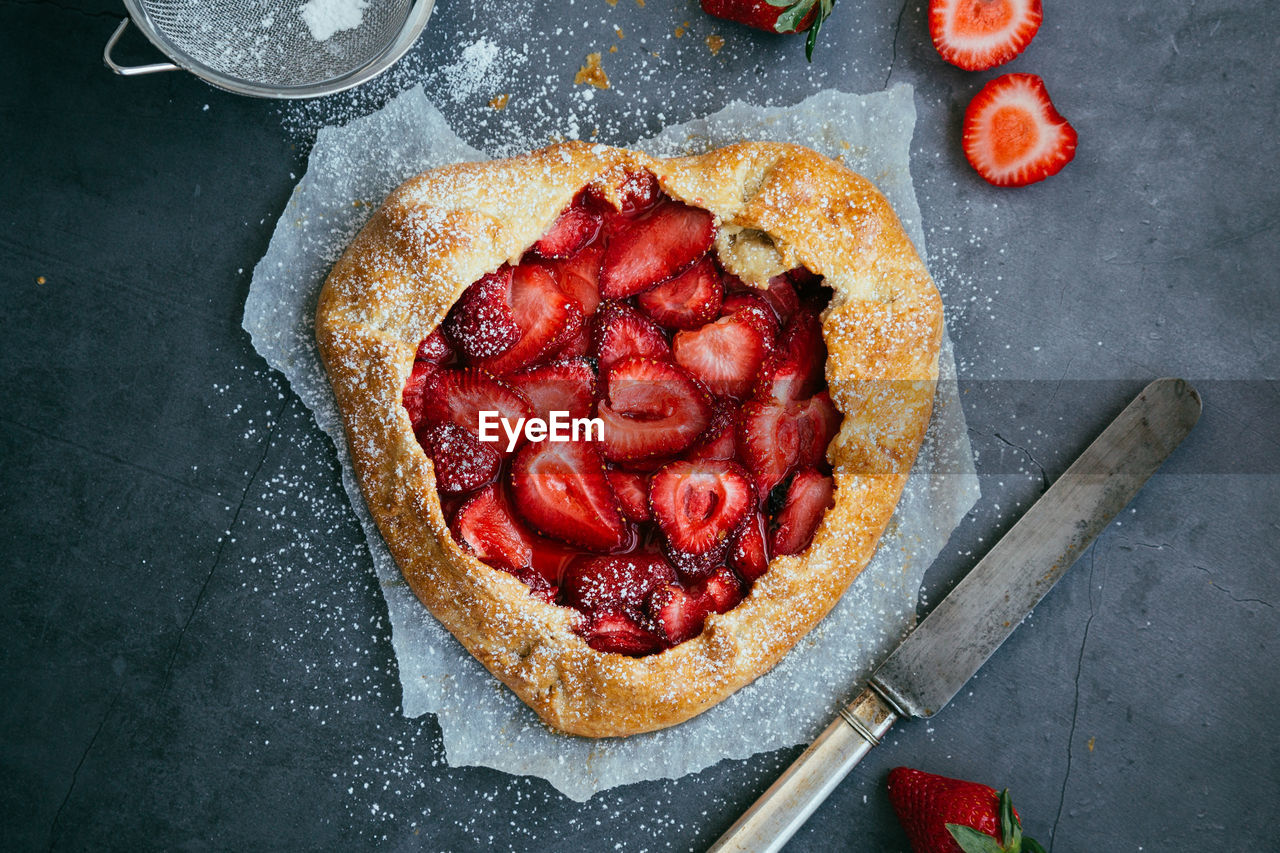 Directly above shot of strawberry tart on table