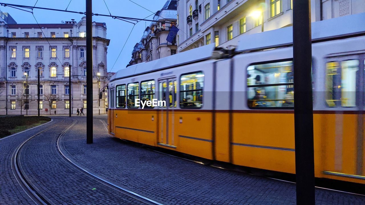 Train on railroad track in city