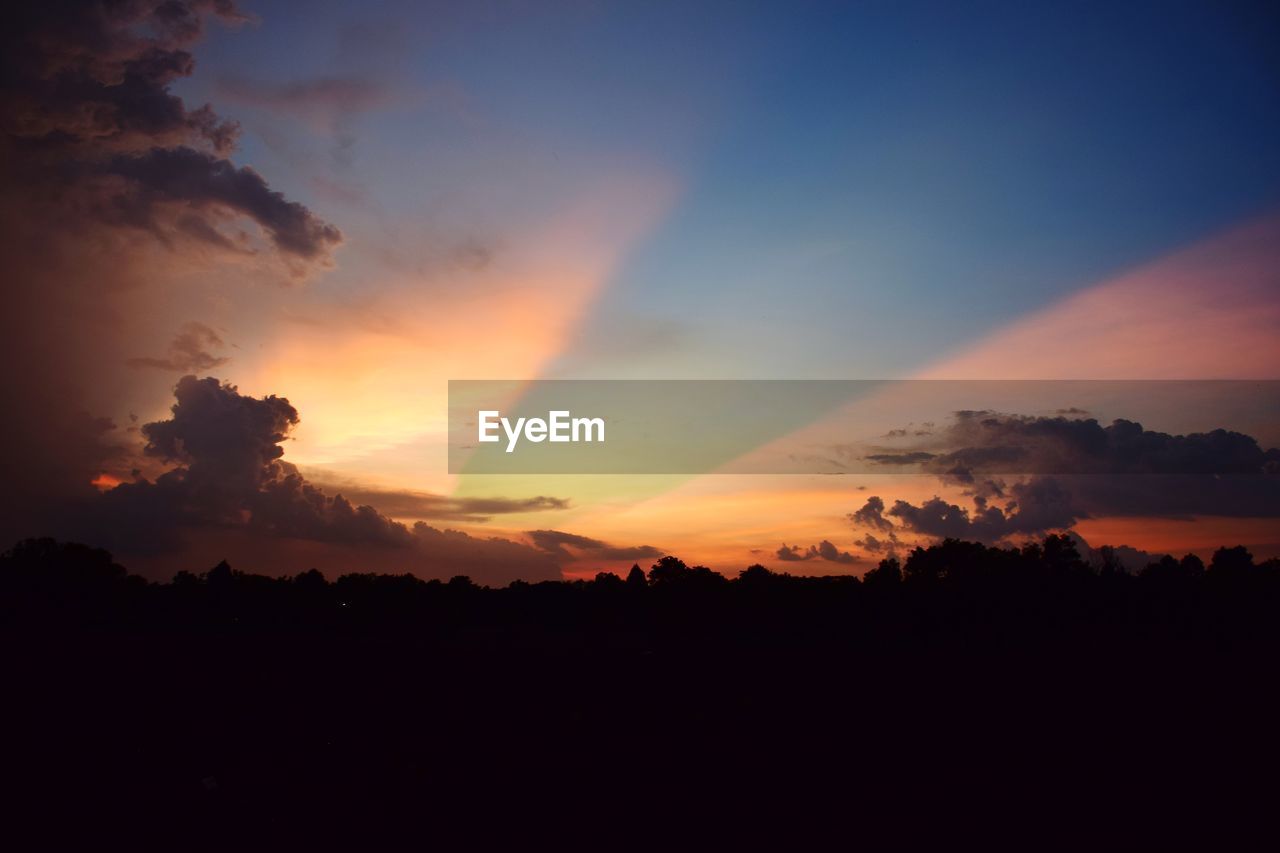 Scenic view of dramatic sky during sunset