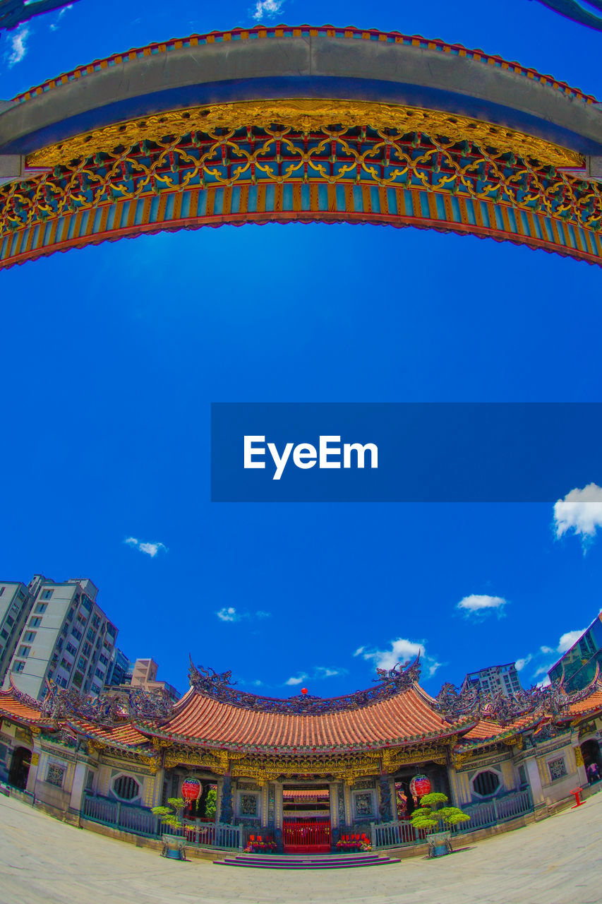 architecture, built structure, landmark, blue, sky, building exterior, travel destinations, sport venue, stadium, building, city, nature, travel, history, arts culture and entertainment, the past, religion, no people, tradition, outdoors, multi colored, arena, belief, tourism, cloud, amusement park, ancient, roof