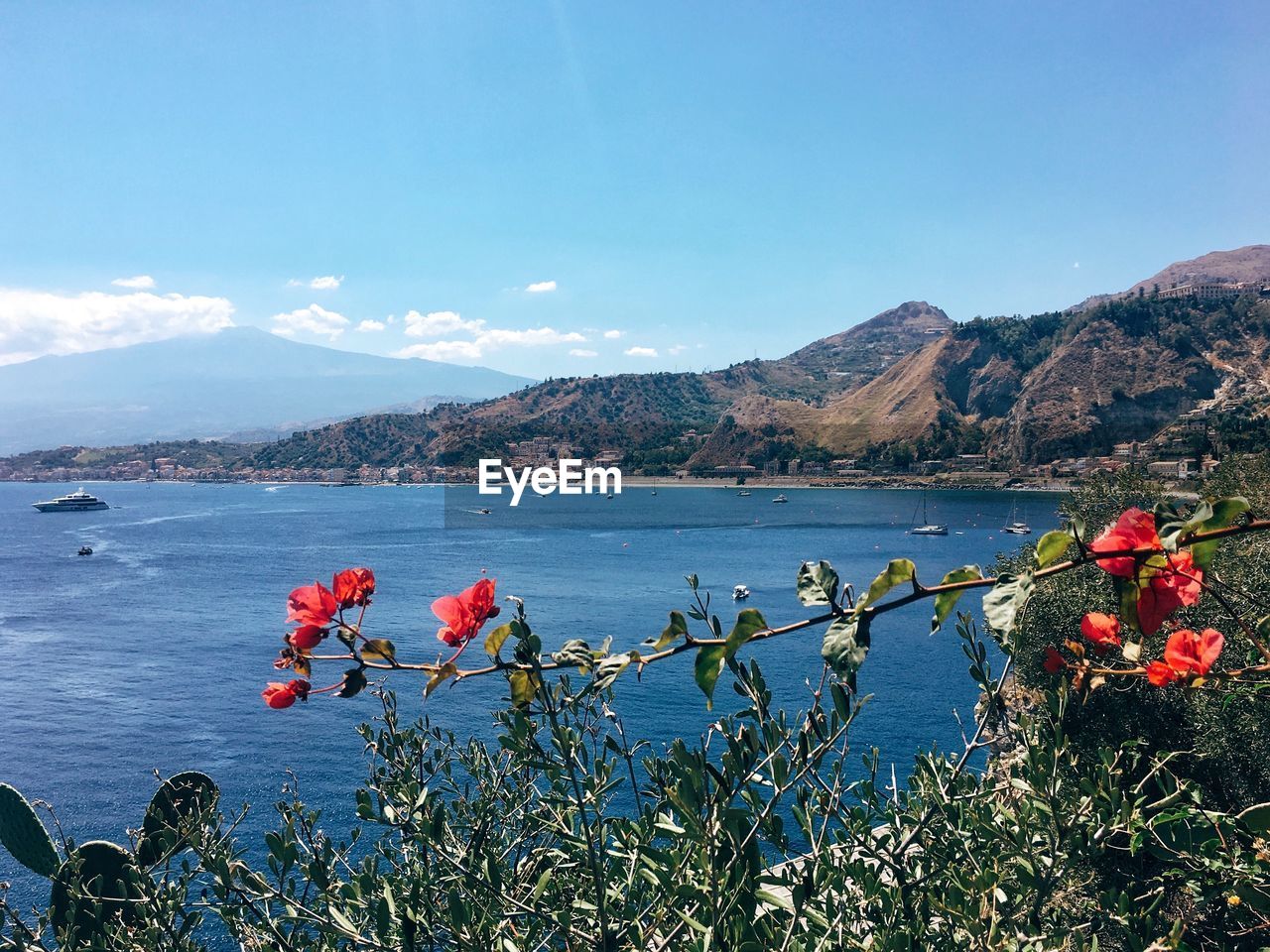 Scenic view of lake against blue sky