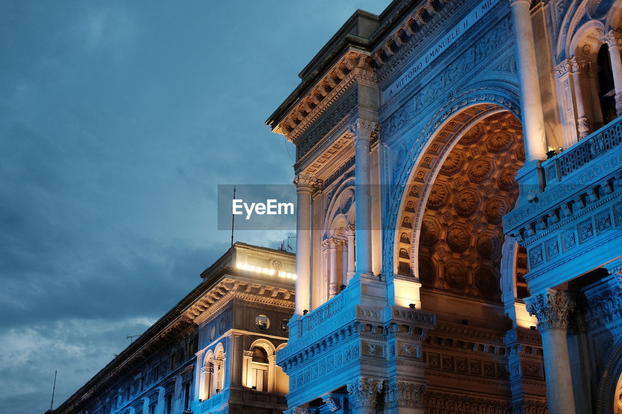 Low angle view of galleria vittorio emanuele ii against sky at dusk