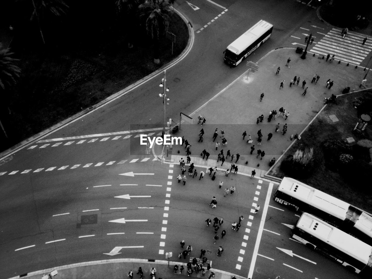 HIGH ANGLE VIEW OF PEOPLE ON ROAD