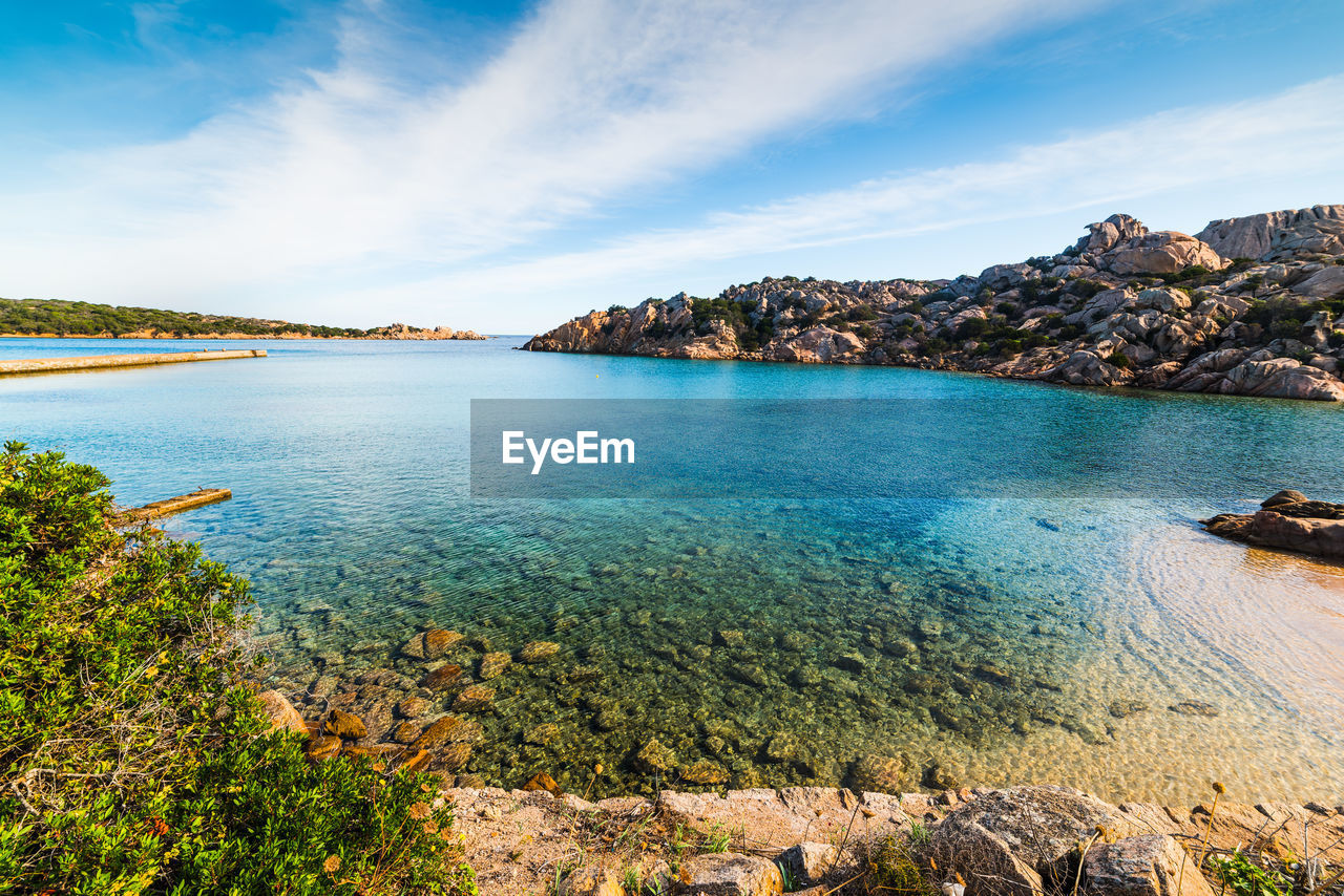 PANORAMIC VIEW OF SEA AND ROCKS AGAINST SKY