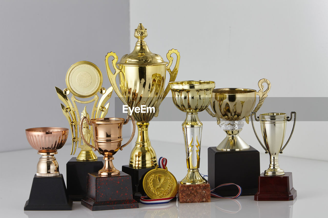 Close up group of trophy on white background