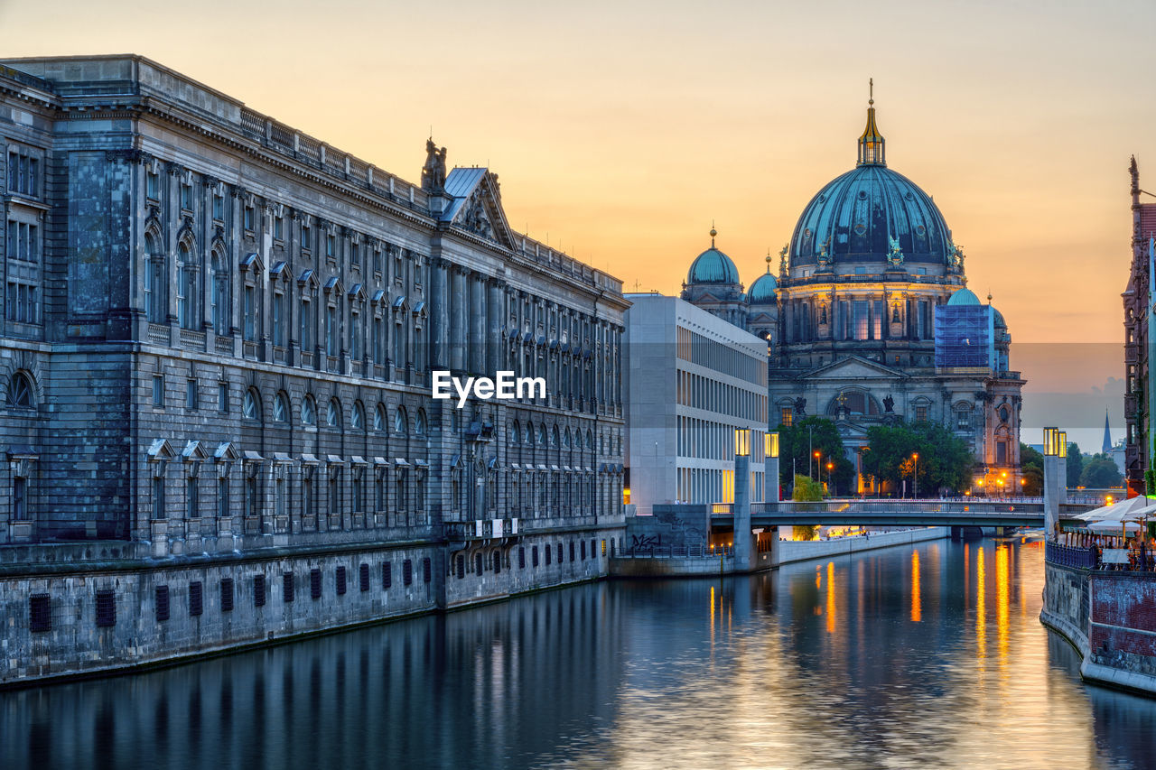 The river spree in berlin after sunset with the cathedral in the back