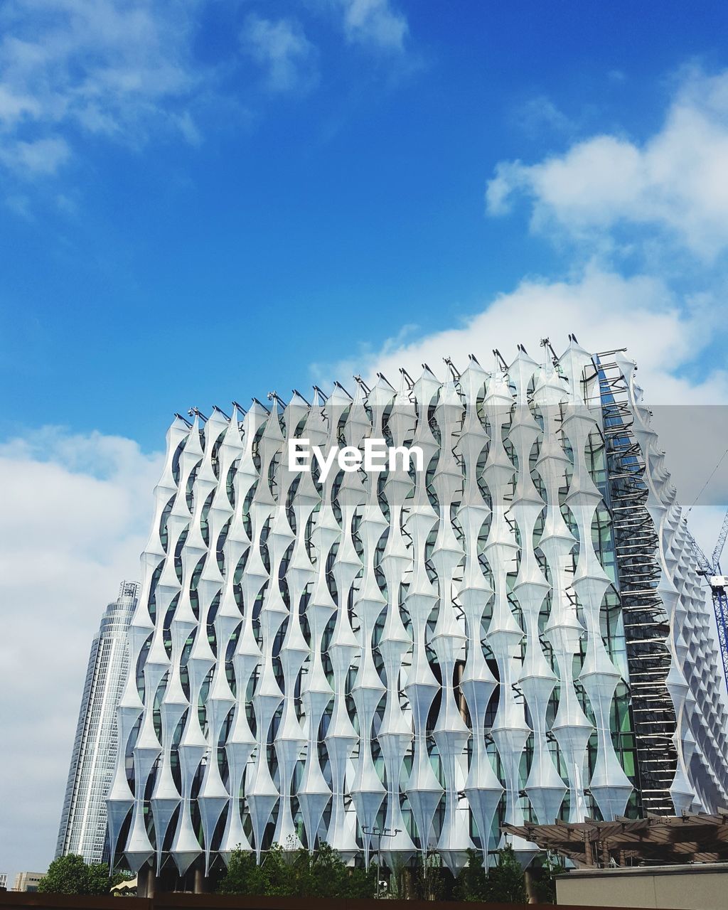 Low angle view of new usa embassy in london uk against cloudy sky