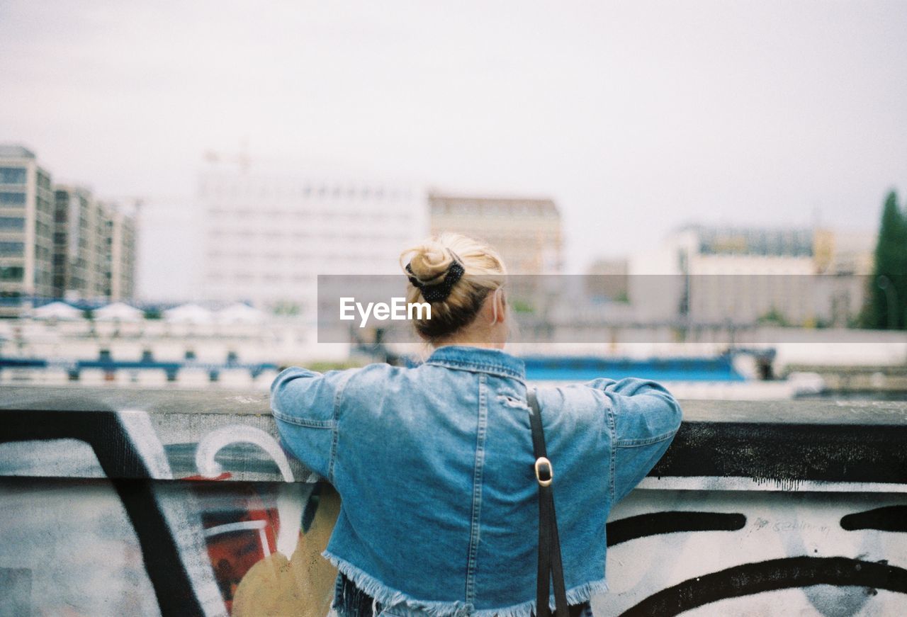 Rear view of woman looking at city