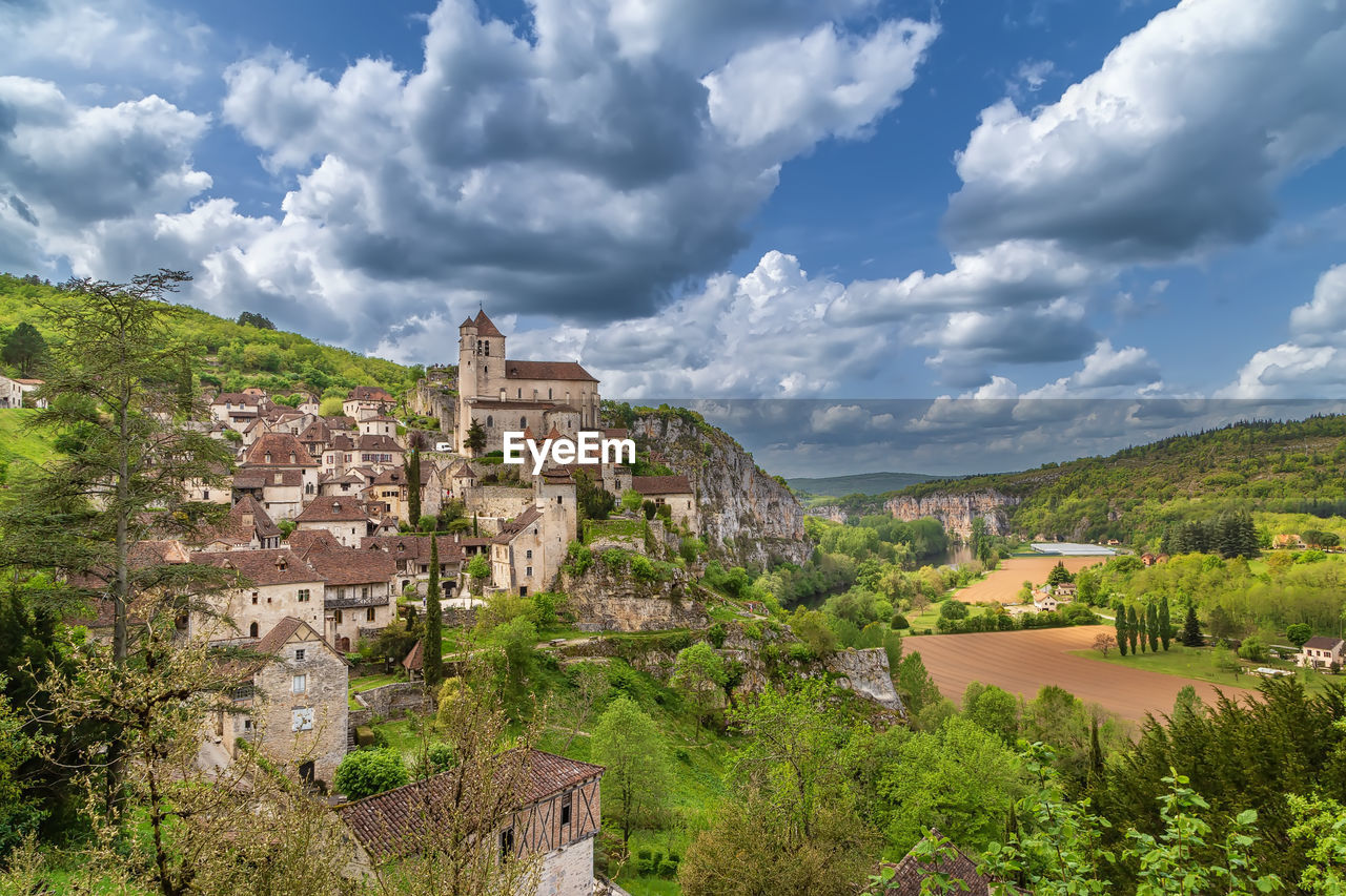 View of saint-cirq-lapopie village with catholic church, france