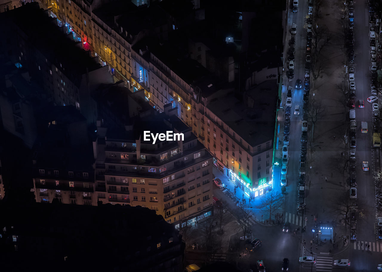 High angle view of buildings in city at night