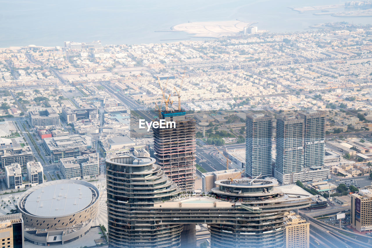 High angle view of buildings in city against sky