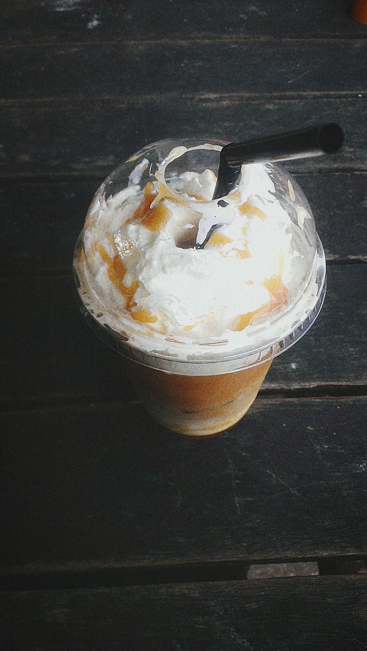 High angle view of milkshake served on table