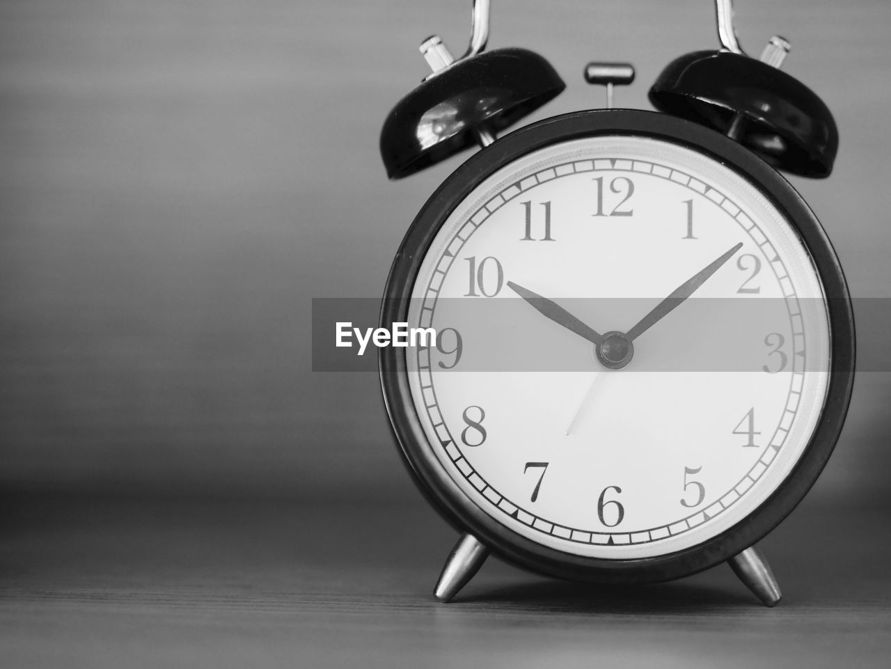 Close-up of clock on table