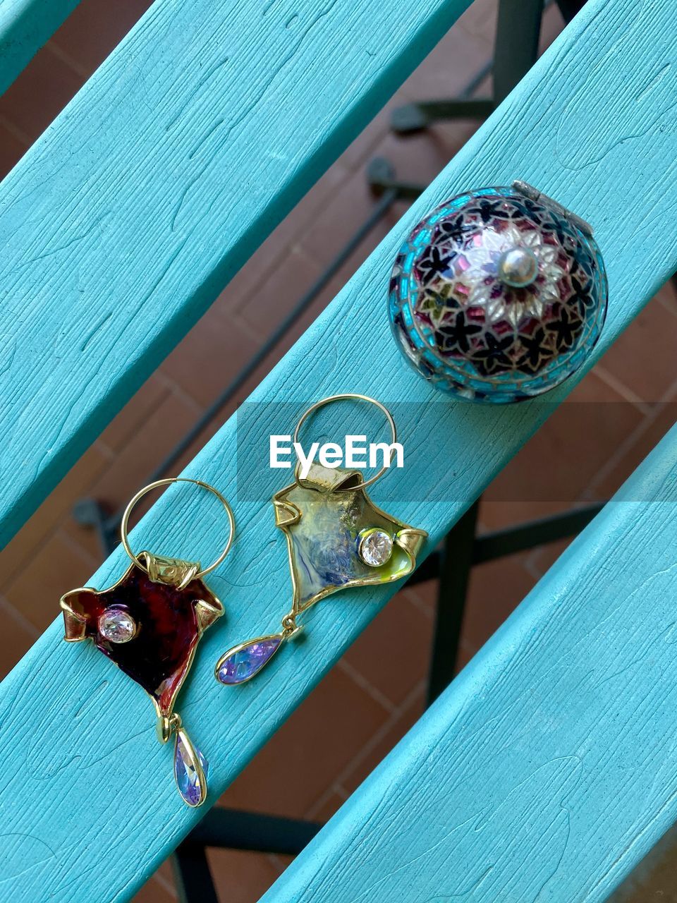 blue, jewellery, green, turquoise, wood, fashion accessory, high angle view, teal, no people, jewelry, day, earring, metal, close-up, purple, table, outdoors