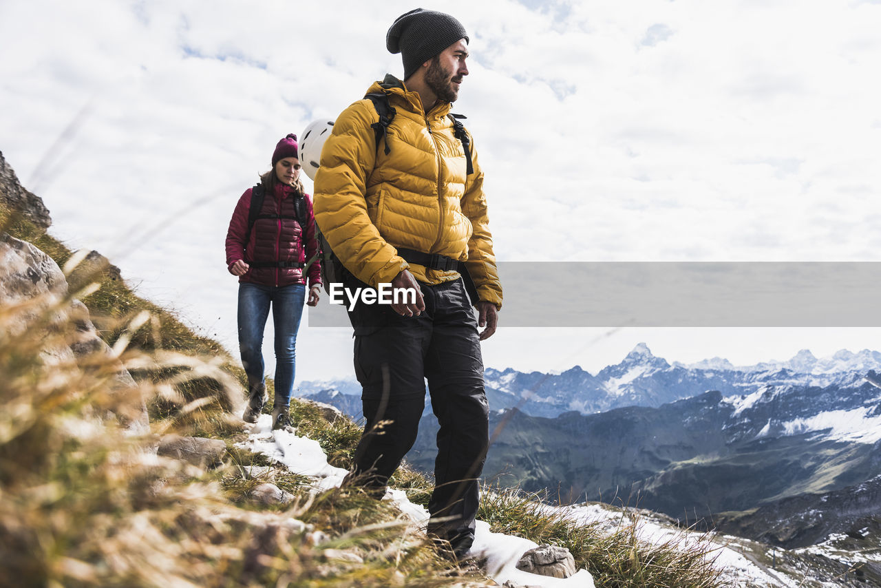 Germany, bavaria, oberstdorf, two hikers walking in alpine scenery