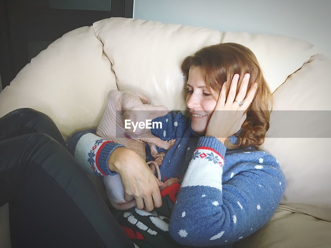 REAR VIEW OF MOTHER AND DAUGHTER SLEEPING AT HOME