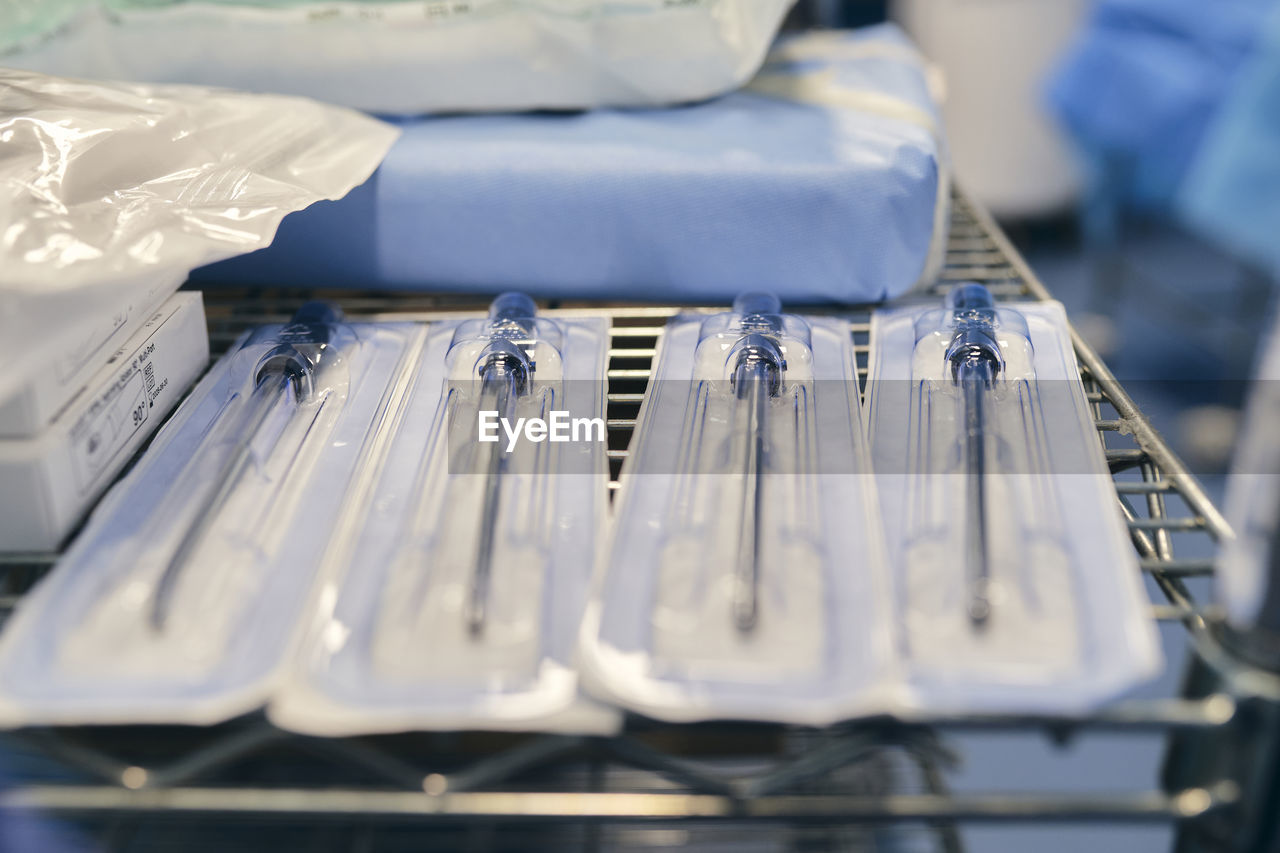 Close-up of medical instrument on rack at hospital