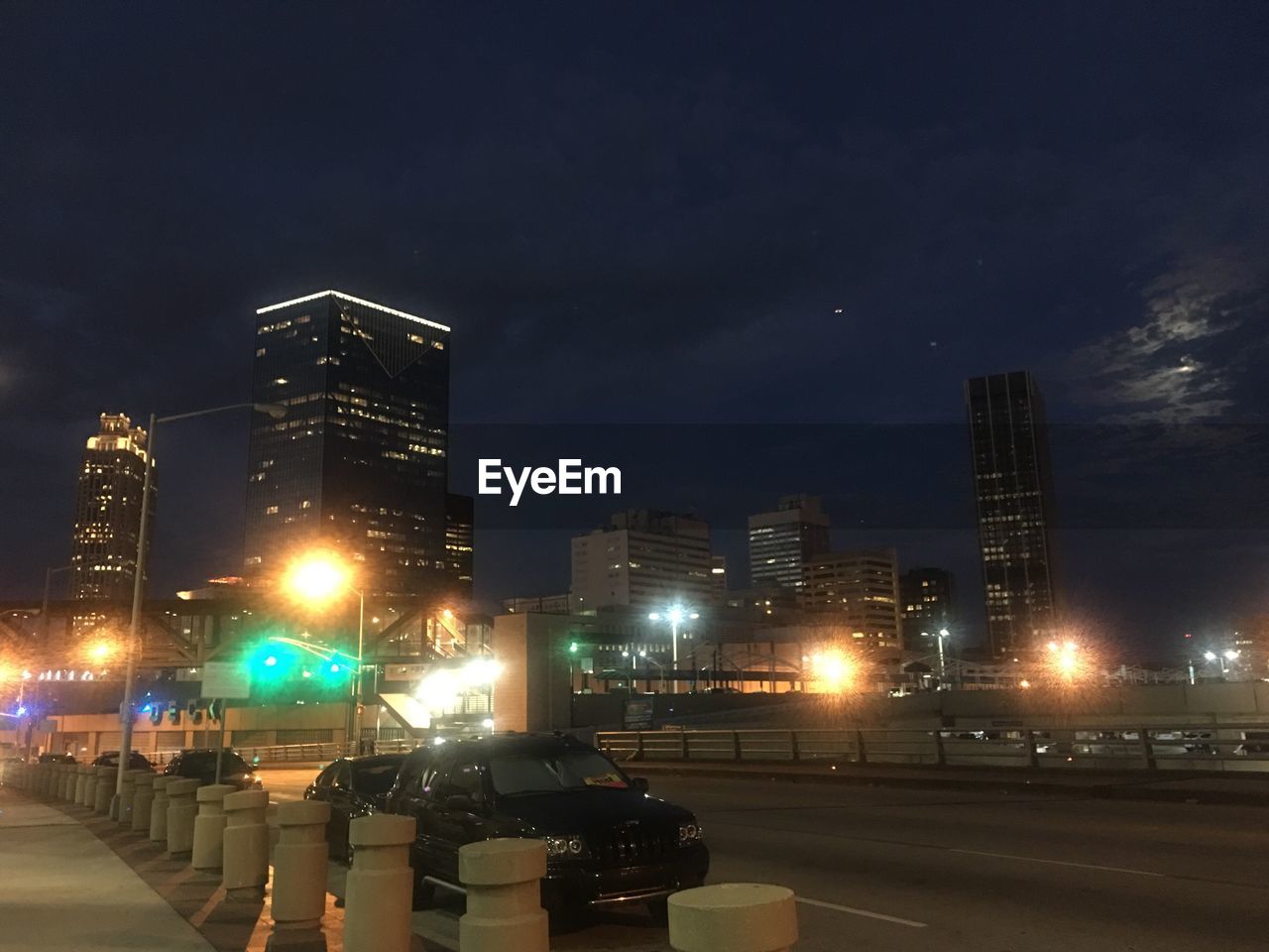 ILLUMINATED CITY STREET AT NIGHT