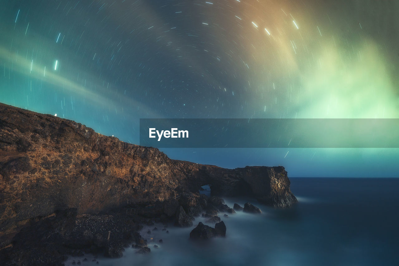 Scenic view of sea against sky at night