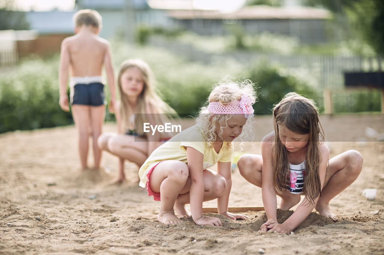 Group of mother and girl on land