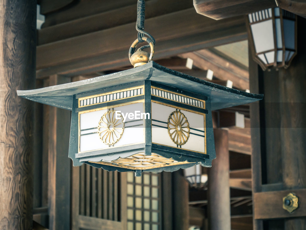 CLOSE-UP OF LANTERN HANGING ON CEILING IN TEMPLE