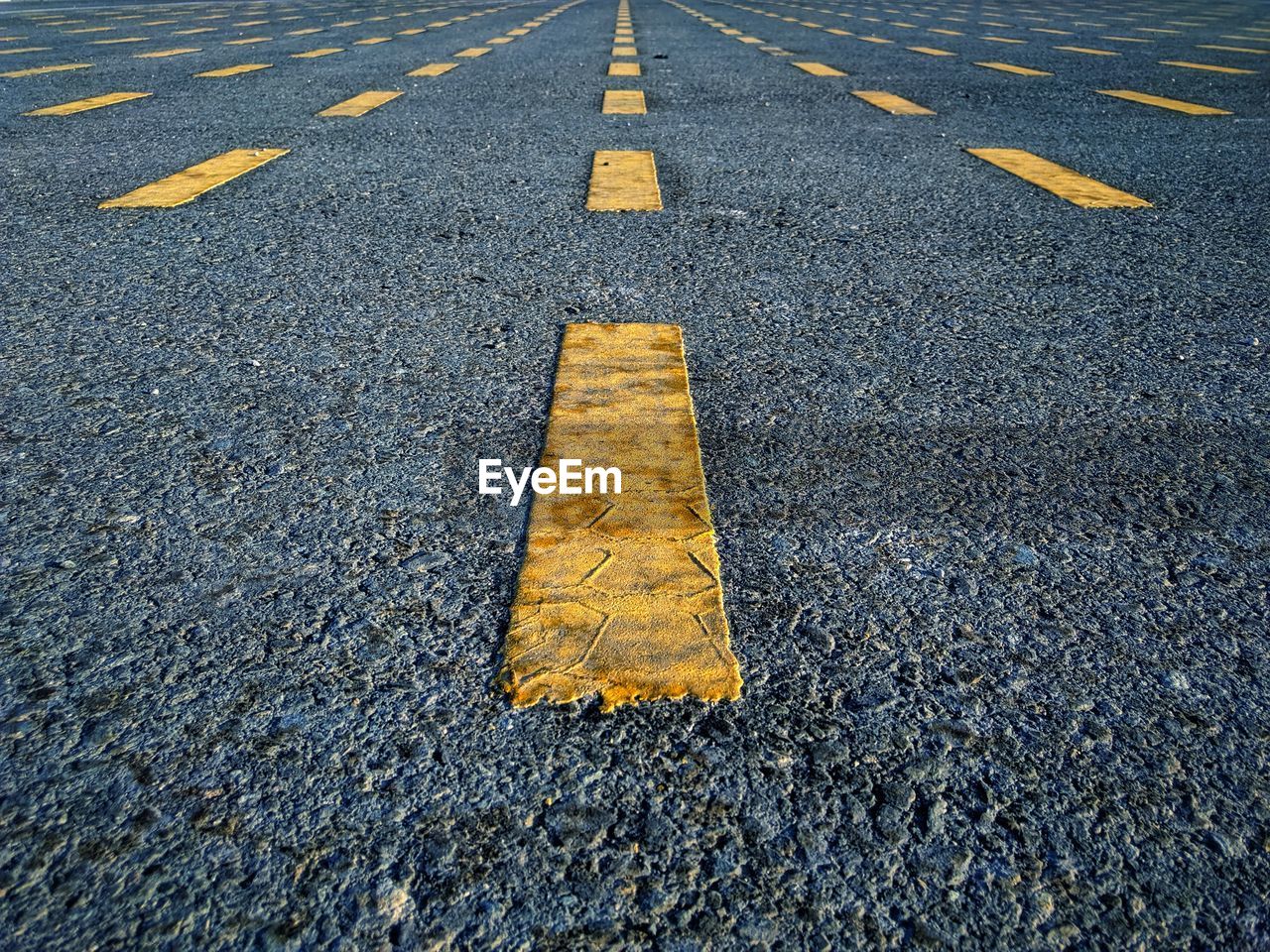 Full frame shot of road with yellow markings