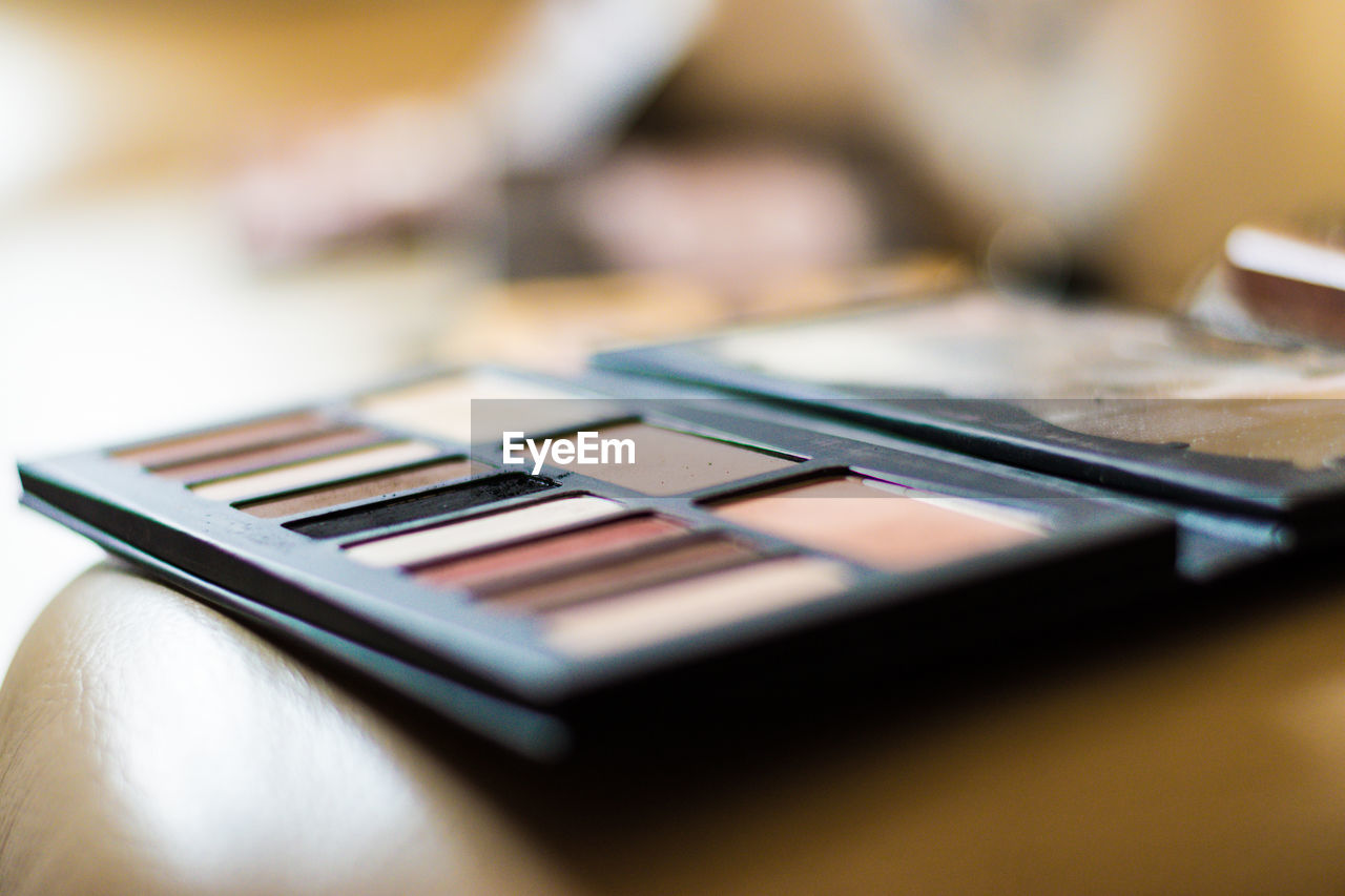 Close-up of make-up palette on table