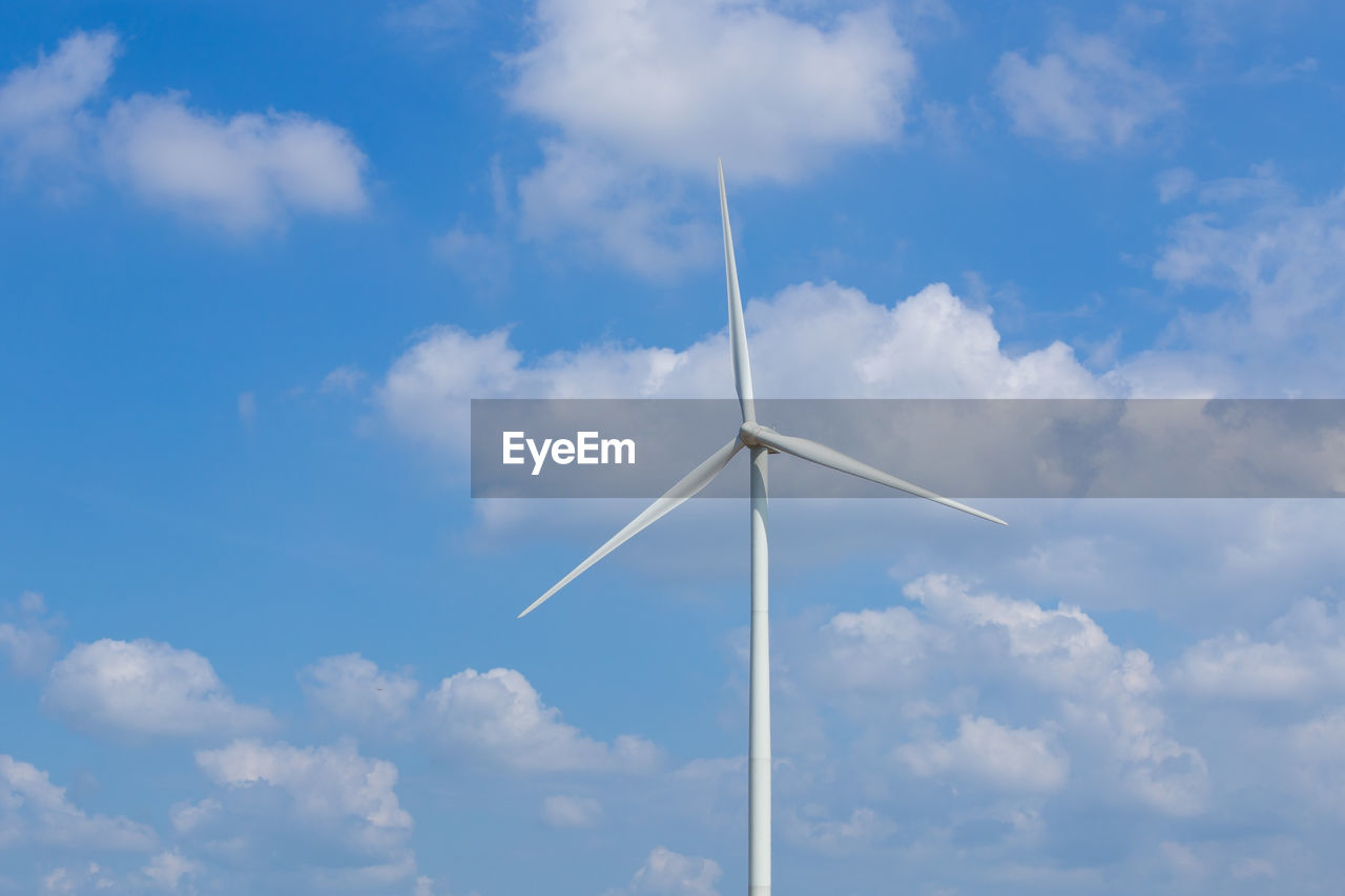 LOW ANGLE VIEW OF WINDMILLS AGAINST SKY