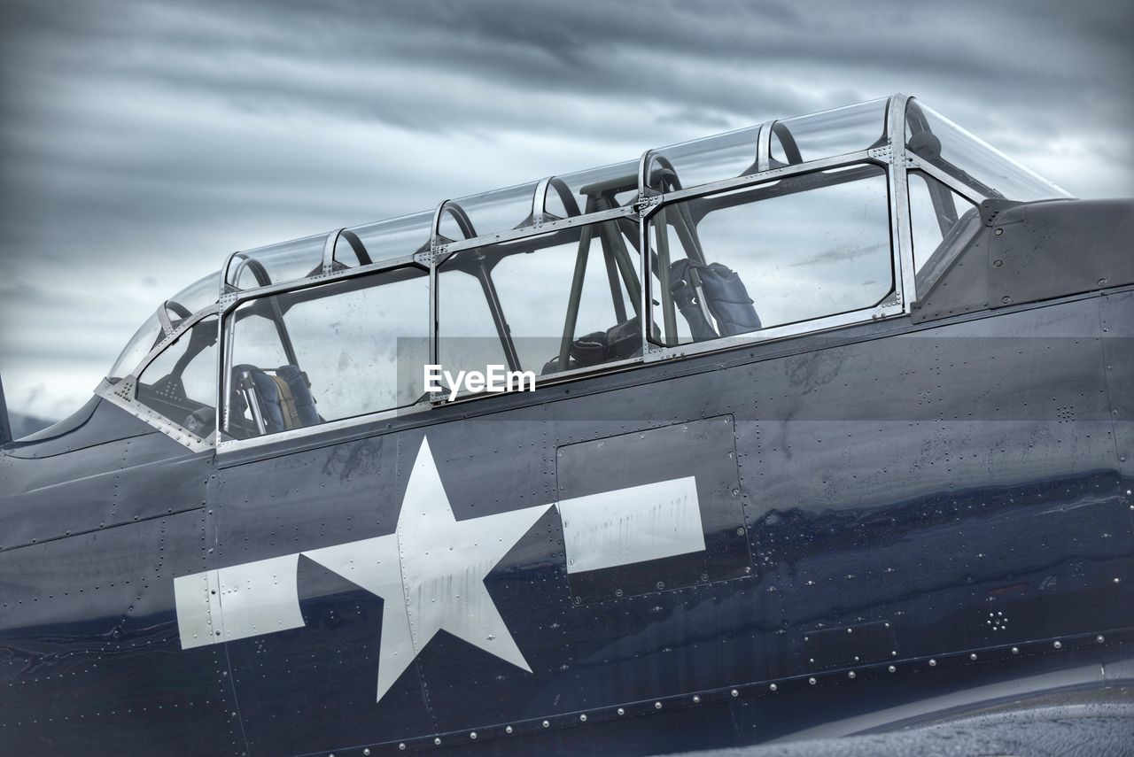 Low angle view of airplane against sky