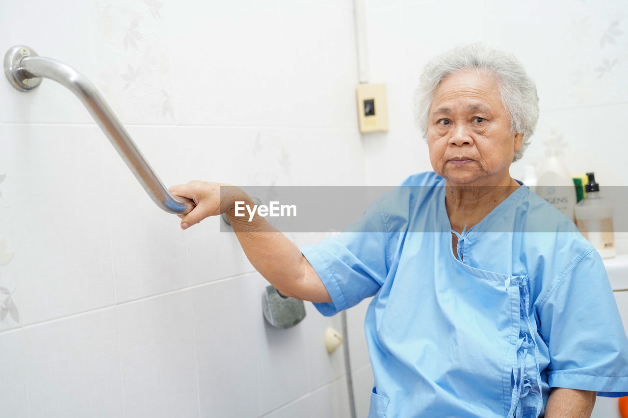 Portrait of senior female patient in bathroom at hospital