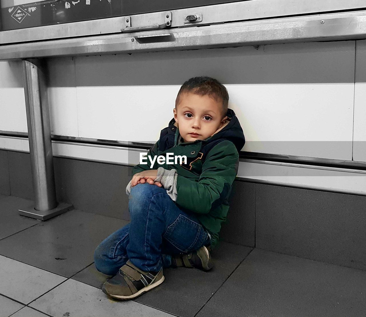 PORTRAIT OF CUTE BOY SITTING