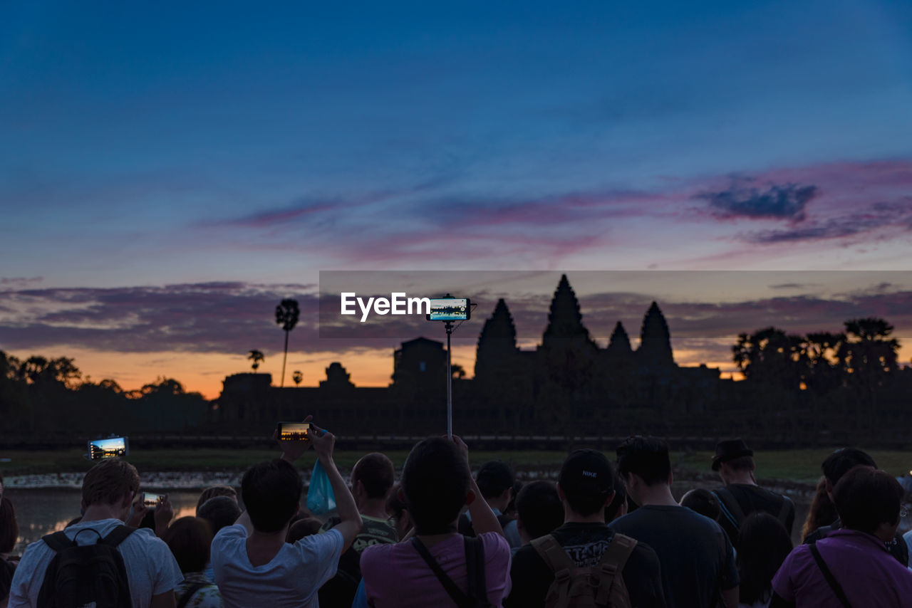 PEOPLE AT TOWN SQUARE DURING SUNSET